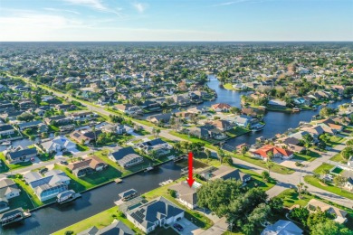 This charming waterfront canal home is a boater's delight with on Palm Harbor Golf Club in Florida - for sale on GolfHomes.com, golf home, golf lot