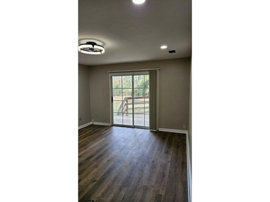 Renovated contemporary townhome with fun diagonal design on Hilaman Park Golf Course in Florida - for sale on GolfHomes.com, golf home, golf lot