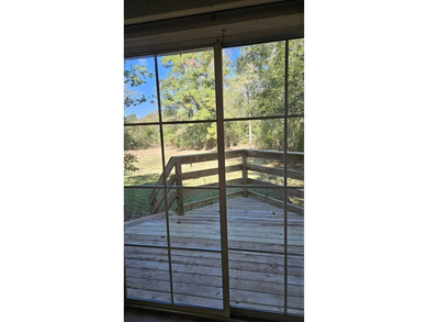 Renovated contemporary townhome with fun diagonal design on Hilaman Park Golf Course in Florida - for sale on GolfHomes.com, golf home, golf lot