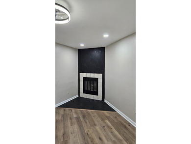 Renovated contemporary townhome with fun diagonal design on Hilaman Park Golf Course in Florida - for sale on GolfHomes.com, golf home, golf lot