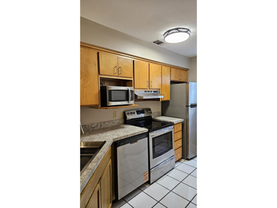 Renovated contemporary townhome with fun diagonal design on Hilaman Park Golf Course in Florida - for sale on GolfHomes.com, golf home, golf lot