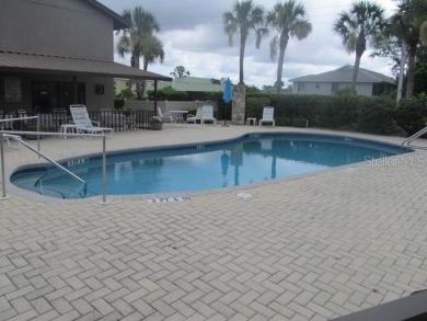 Located in the middle of just about anything you could need on Capri Isle Golf Club in Florida - for sale on GolfHomes.com, golf home, golf lot
