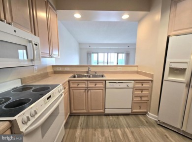 Sky-high living in this top floor condo with 2 spacious bedrooms on Leisure World Golf Club in Maryland - for sale on GolfHomes.com, golf home, golf lot