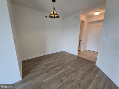 Sky-high living in this top floor condo with 2 spacious bedrooms on Leisure World Golf Club in Maryland - for sale on GolfHomes.com, golf home, golf lot