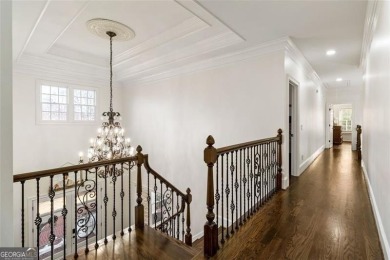 Introducing a triumph of luxury yet a warm, cozy home featured on TPC At Sugarloaf Golf Club in Georgia - for sale on GolfHomes.com, golf home, golf lot