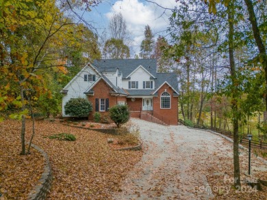 This beautifully remodeled home is nestled on nearly 1.5 acres on Green Oaks Golf Course in North Carolina - for sale on GolfHomes.com, golf home, golf lot