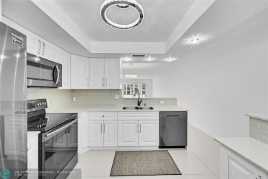 FULLY RENOVATED 2/2 IN THE WYNMOOR GOLF COMMUNITY. THE KITCHEN on Wynmoor Golf Course in Florida - for sale on GolfHomes.com, golf home, golf lot