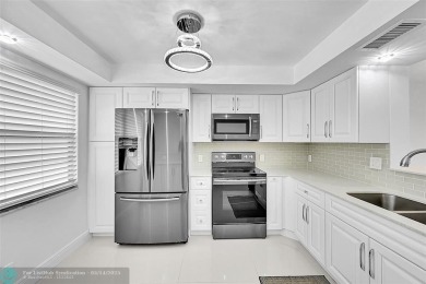 FULLY RENOVATED 2/2 IN THE WYNMOOR GOLF COMMUNITY. THE KITCHEN on Wynmoor Golf Course in Florida - for sale on GolfHomes.com, golf home, golf lot
