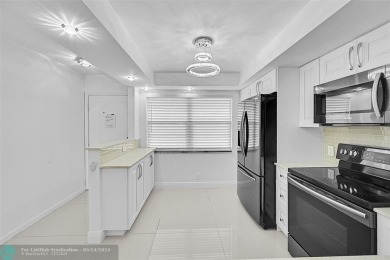 FULLY RENOVATED 2/2 IN THE WYNMOOR GOLF COMMUNITY. THE KITCHEN on Wynmoor Golf Course in Florida - for sale on GolfHomes.com, golf home, golf lot