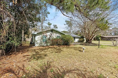 Endless potential and opportunity here! A spacious 4-bedroom, 2 on Jake Gaither Golf Course in Florida - for sale on GolfHomes.com, golf home, golf lot