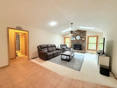 Enclosed glass sunroom offers year-round enjoyment from this on Cortez Golf Course in Arkansas - for sale on GolfHomes.com, golf home, golf lot