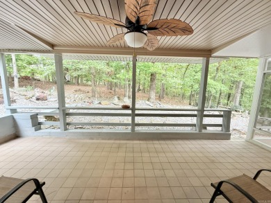 Enclosed glass sunroom offers year-round enjoyment from this on Cortez Golf Course in Arkansas - for sale on GolfHomes.com, golf home, golf lot
