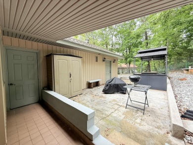Enclosed glass sunroom offers year-round enjoyment from this on Cortez Golf Course in Arkansas - for sale on GolfHomes.com, golf home, golf lot