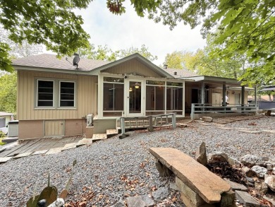Enclosed glass sunroom offers year-round enjoyment from this on Cortez Golf Course in Arkansas - for sale on GolfHomes.com, golf home, golf lot