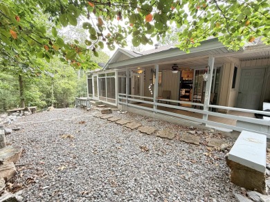 Enclosed glass sunroom offers year-round enjoyment from this on Cortez Golf Course in Arkansas - for sale on GolfHomes.com, golf home, golf lot