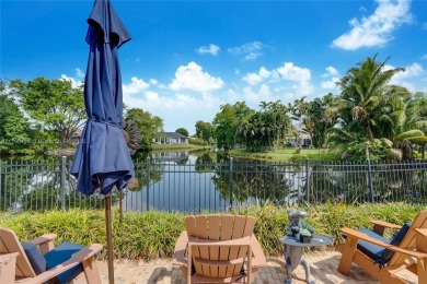 Welcome to this stunning 4 bed, 2.5-bath lakefront home located on Jacaranda Golf Club in Florida - for sale on GolfHomes.com, golf home, golf lot