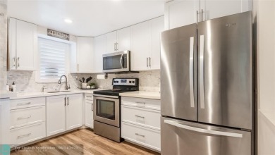 Beautifully remodeled condo with an open spacious layout! Tile on  in Florida - for sale on GolfHomes.com, golf home, golf lot