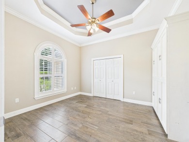 Situated on an oversized lot and a half, this beautifully on Fairway Oaks at Magnolia Golf Course in Florida - for sale on GolfHomes.com, golf home, golf lot