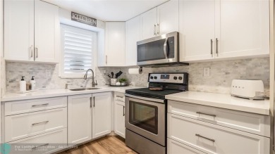 Beautifully remodeled condo with an open spacious layout! Tile on  in Florida - for sale on GolfHomes.com, golf home, golf lot