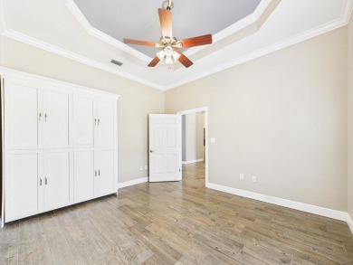 Situated on an oversized lot and a half, this beautifully on Fairway Oaks at Magnolia Golf Course in Florida - for sale on GolfHomes.com, golf home, golf lot