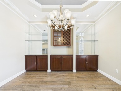 Situated on an oversized lot and a half, this beautifully on Fairway Oaks at Magnolia Golf Course in Florida - for sale on GolfHomes.com, golf home, golf lot