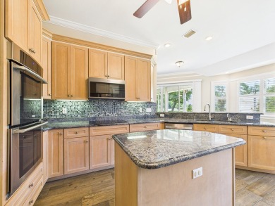 Situated on an oversized lot and a half, this beautifully on Fairway Oaks at Magnolia Golf Course in Florida - for sale on GolfHomes.com, golf home, golf lot