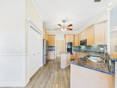 Situated on an oversized lot and a half, this beautifully on Fairway Oaks at Magnolia Golf Course in Florida - for sale on GolfHomes.com, golf home, golf lot