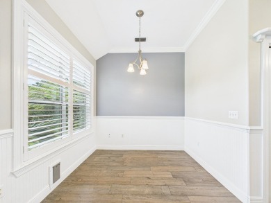 Situated on an oversized lot and a half, this beautifully on Fairway Oaks at Magnolia Golf Course in Florida - for sale on GolfHomes.com, golf home, golf lot