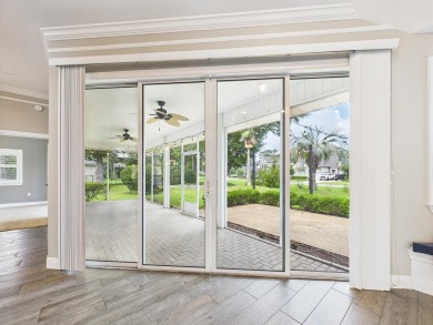Situated on an oversized lot and a half, this beautifully on Fairway Oaks at Magnolia Golf Course in Florida - for sale on GolfHomes.com, golf home, golf lot