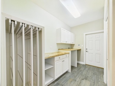 Situated on an oversized lot and a half, this beautifully on Fairway Oaks at Magnolia Golf Course in Florida - for sale on GolfHomes.com, golf home, golf lot