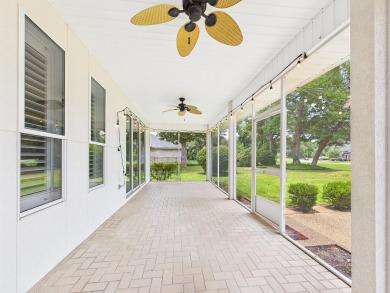 Situated on an oversized lot and a half, this beautifully on Fairway Oaks at Magnolia Golf Course in Florida - for sale on GolfHomes.com, golf home, golf lot
