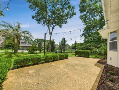 Situated on an oversized lot and a half, this beautifully on Fairway Oaks at Magnolia Golf Course in Florida - for sale on GolfHomes.com, golf home, golf lot