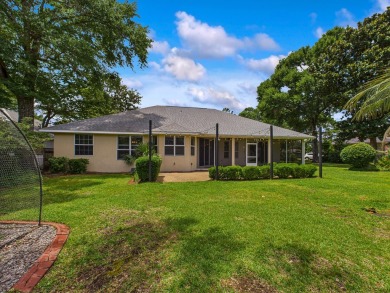 Situated on an oversized lot and a half, this beautifully on Fairway Oaks at Magnolia Golf Course in Florida - for sale on GolfHomes.com, golf home, golf lot