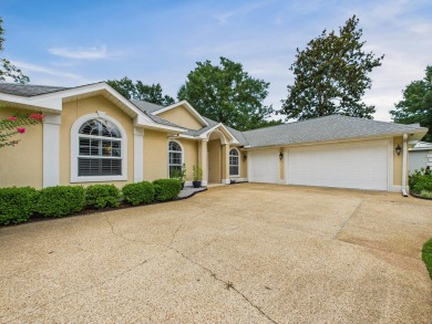 Situated on an oversized lot and a half, this beautifully on Fairway Oaks at Magnolia Golf Course in Florida - for sale on GolfHomes.com, golf home, golf lot