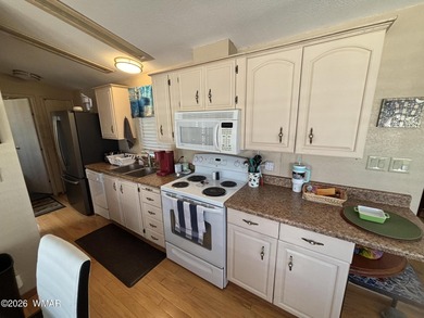 Come see this Beautiful home backing the peaceful Pond and on Juniper Ridge R.V. Golf Resort in Arizona - for sale on GolfHomes.com, golf home, golf lot