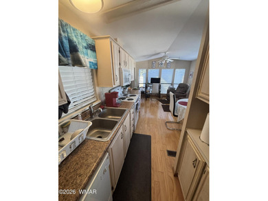 Come see this Beautiful home backing the peaceful Pond and on Juniper Ridge R.V. Golf Resort in Arizona - for sale on GolfHomes.com, golf home, golf lot