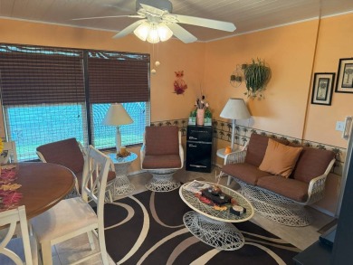 Discover why this highly sought-after two-bedroom, two-bathroom on Four Lakes Golf Club in Florida - for sale on GolfHomes.com, golf home, golf lot