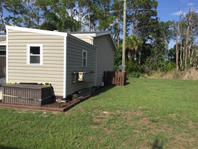 Move right into this beautifully updated home tucked back into a on Spanish Lakes I in Florida - for sale on GolfHomes.com, golf home, golf lot