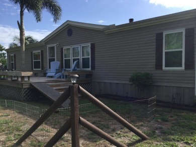Move right into this beautifully updated home tucked back into a on Spanish Lakes I in Florida - for sale on GolfHomes.com, golf home, golf lot