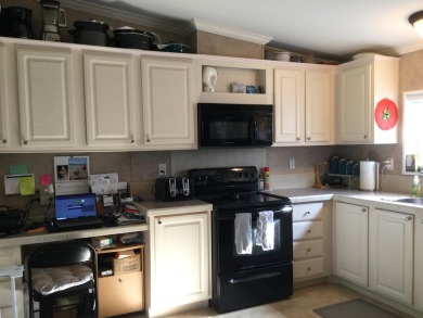 Move right into this beautifully updated home tucked back into a on Spanish Lakes I in Florida - for sale on GolfHomes.com, golf home, golf lot