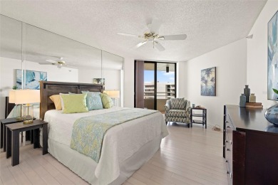 Lush tropical and water views await from this 12th floor condo on Pasadena Yacht and Country Club in Florida - for sale on GolfHomes.com, golf home, golf lot