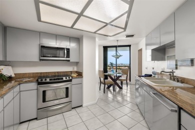 Lush tropical and water views await from this 12th floor condo on Pasadena Yacht and Country Club in Florida - for sale on GolfHomes.com, golf home, golf lot
