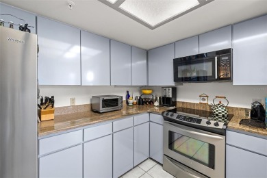 Lush tropical and water views await from this 12th floor condo on Pasadena Yacht and Country Club in Florida - for sale on GolfHomes.com, golf home, golf lot