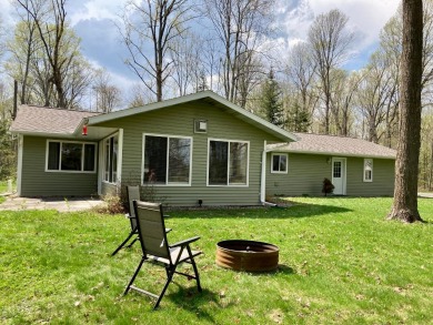 With access to Big Twin Lake in a beautifully wooded country on Maplewood Golf Course in Wisconsin - for sale on GolfHomes.com, golf home, golf lot