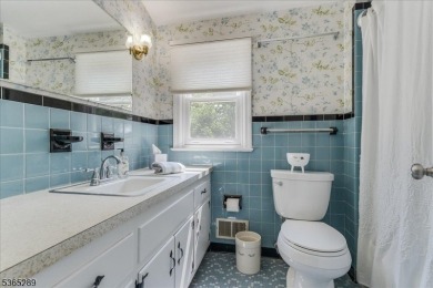 As you step inside, you're greeted by an inviting foyer that on Packanack Golf Club in New Jersey - for sale on GolfHomes.com, golf home, golf lot