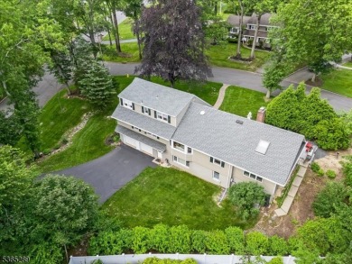 As you step inside, you're greeted by an inviting foyer that on Packanack Golf Club in New Jersey - for sale on GolfHomes.com, golf home, golf lot