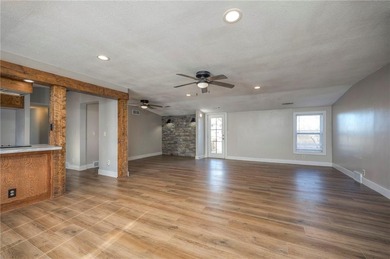 This home is the perfect blend of comfort, charm, function, and on Linn Valley Lakes - Deer Trace Golf Course in Kansas - for sale on GolfHomes.com, golf home, golf lot