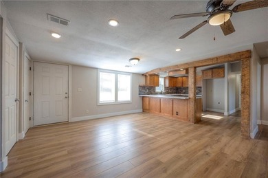 This home is the perfect blend of comfort, charm, function, and on Linn Valley Lakes - Deer Trace Golf Course in Kansas - for sale on GolfHomes.com, golf home, golf lot