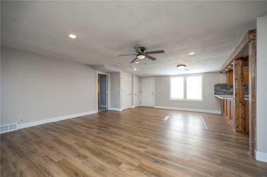 This home is the perfect blend of comfort, charm, function, and on Linn Valley Lakes - Deer Trace Golf Course in Kansas - for sale on GolfHomes.com, golf home, golf lot