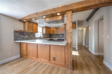 This home is the perfect blend of comfort, charm, function, and on Linn Valley Lakes - Deer Trace Golf Course in Kansas - for sale on GolfHomes.com, golf home, golf lot